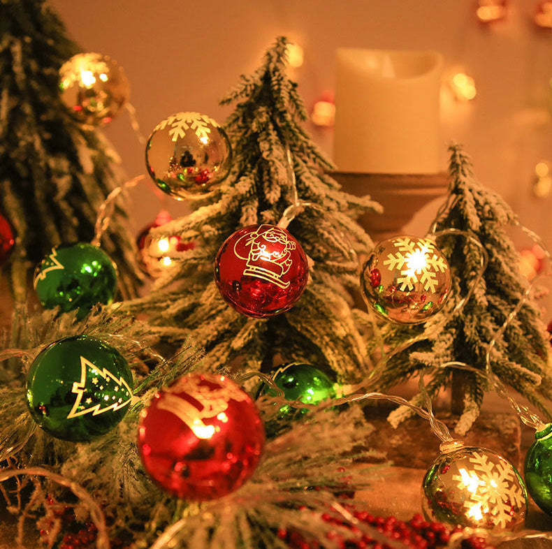 Decorative Christmas tree with colorful ornaments and lights.